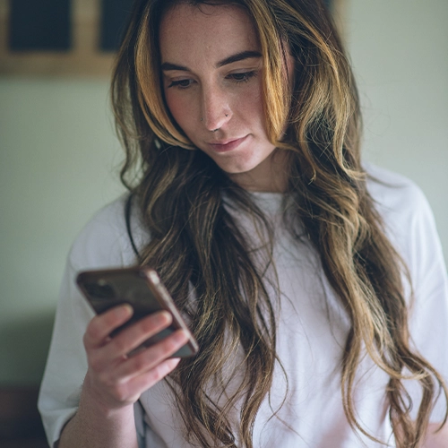 Customer looking at mobile phone