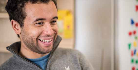 Customer smiling in kitchen